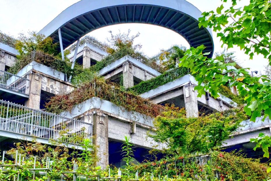 A close-up view of the lush tiered green roof at Green Hill Shanghai, showcasing its unique integration of vegetation and urban architecture.